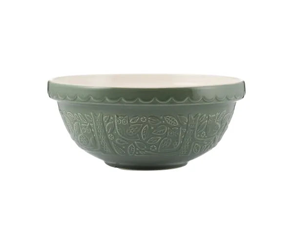 A dark green, embossed mixing bowl with owl and woodland scenes.