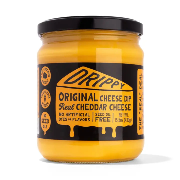 Jar of Drippy Original Cheese Dip with black lid on a white background