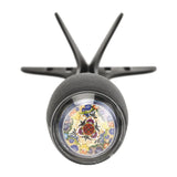 A black cylindrical wall-mounted light fixture with a clear protective lens over a colorful stained-glass-style floral pattern, shown against a plain white background.