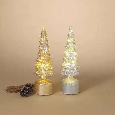 Two illuminated Christmas tree-shaped lights on a beige background