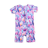 A multicolored floral shorty zip one-piece baby garment with a 2-way zipper