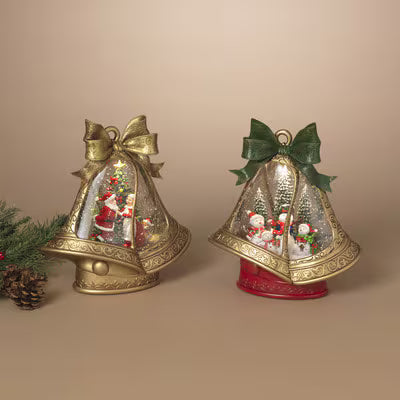 Two decorative Christmas bells with animated scenes inside on a beige background