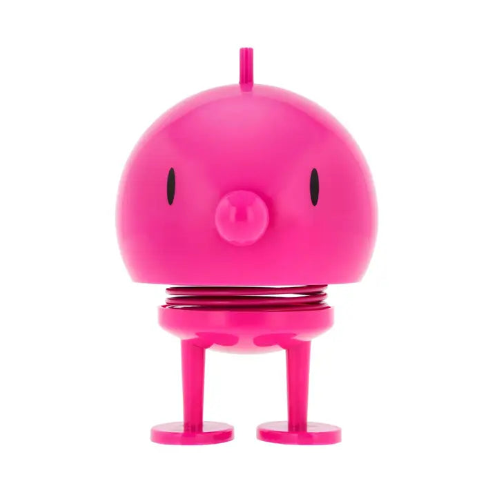 Pink robot toy with a simple design on a white background