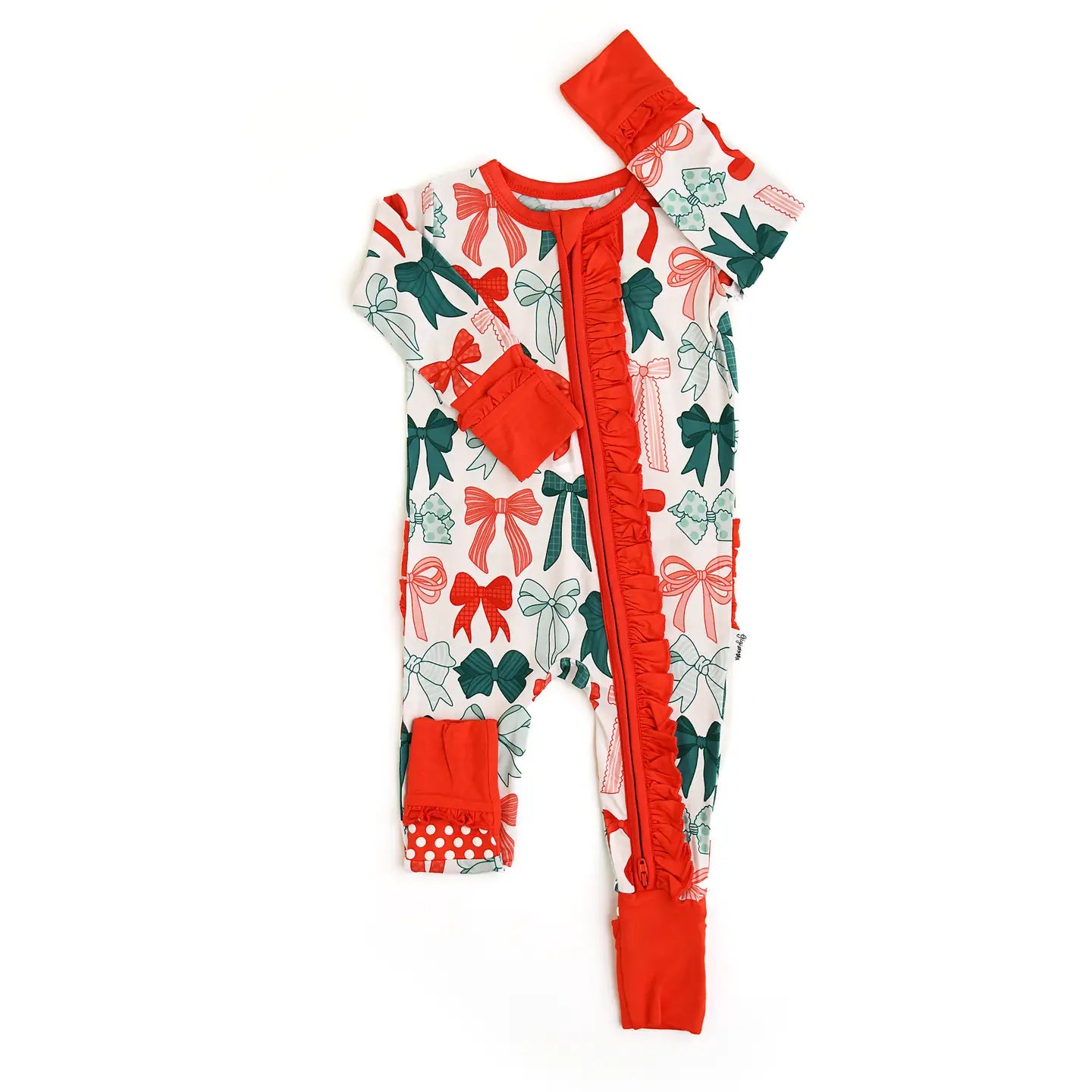 Baby onesie with red and green bow pattern on a white background