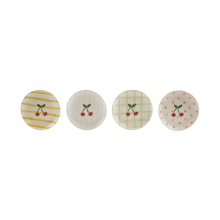 Set of four decorative plates with cherry design on a white background