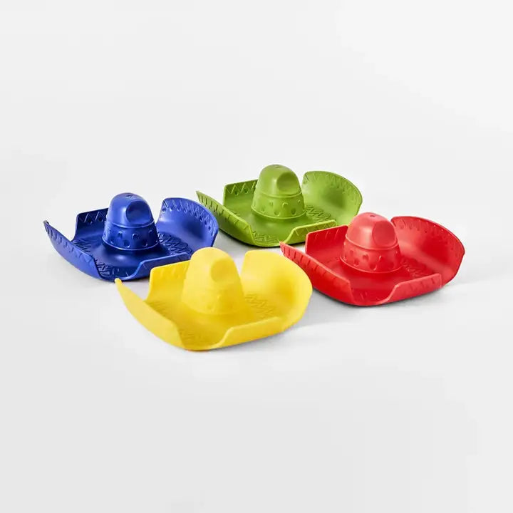 Four small sombrero-shaped bath toys in blue, green, yellow, and red, arranged on a light gray background.