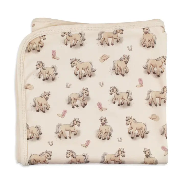 Blanket with horse pattern on a white background