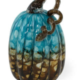 Glass pumpkin pendant with blue and brown patterns on a white background