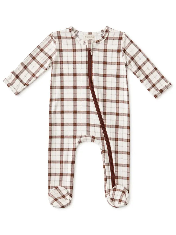 A baby footed sleeper with long sleeves and a front zipper, featuring a brown and white plaid pattern on a white background.
