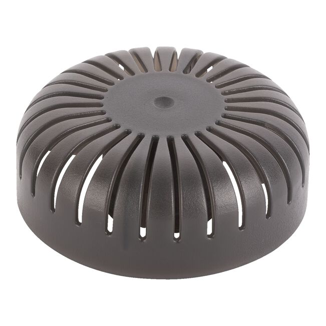 Round metallic object with a textured surface on a white background