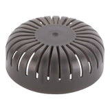 Round metallic object with a textured surface on a white background