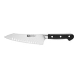 A stainless steel kitchen knife with a black textured handle, shown horizontally against a plain white background. The brand name 'Dexter' is clearly visible on both the blade and the handle.