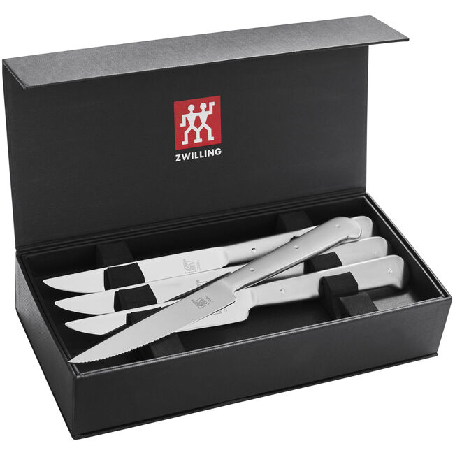 Box of silver metal steak knifes 