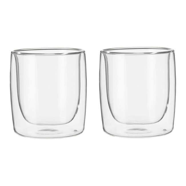 Two clear glass tumblers on a white background
