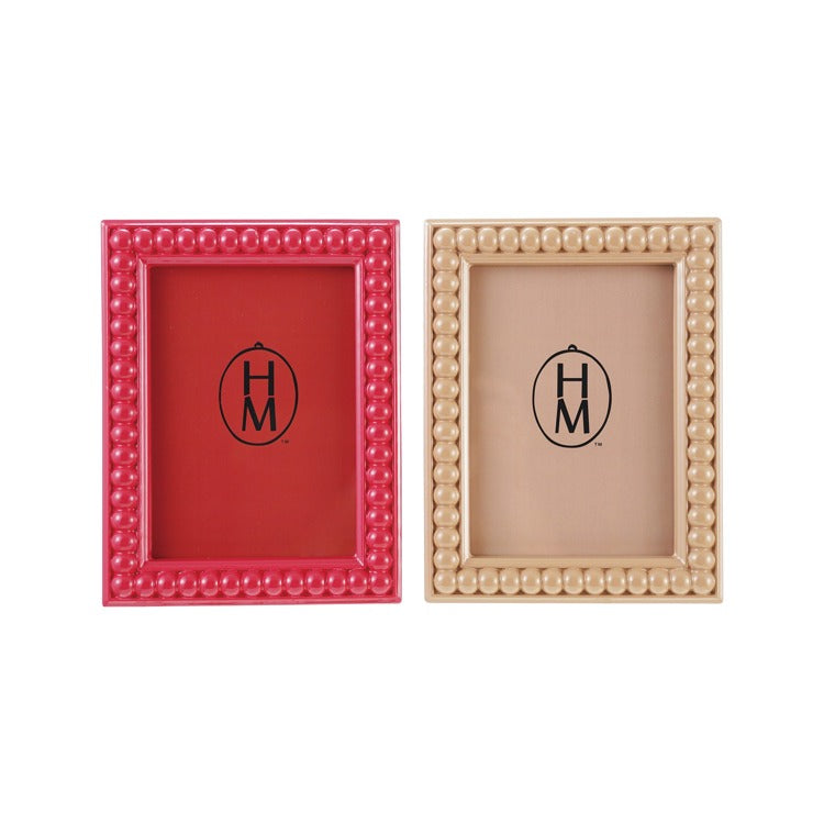 Two picture frames, one red and one beige, with a visible brand logo on a white background.