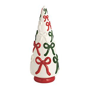 Decorative candle shaped like a Christmas tree with red and green bows on a white background