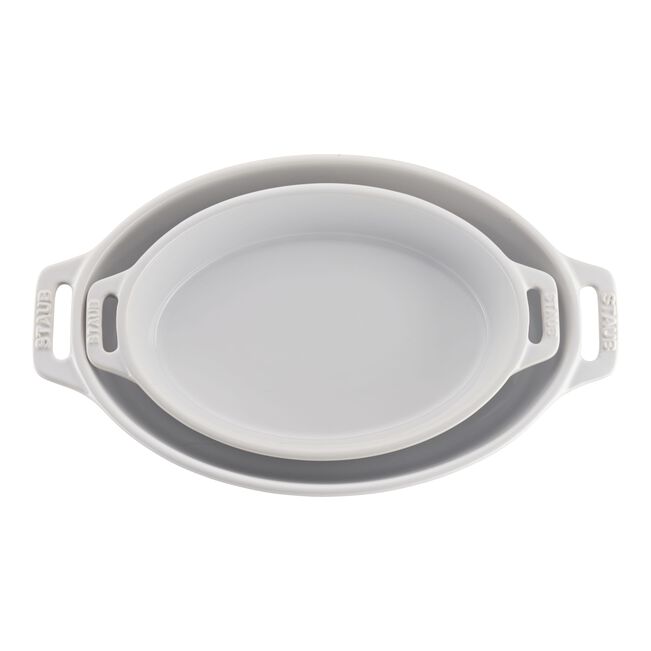 Collapsible silicone food container with handles on a white background