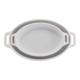 Collapsible silicone food container with handles on a white background