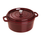 Red cast iron cookware pot with lid on a white background
