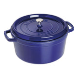 Blue Staub cocotte with lid on a white background