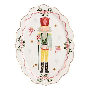 Decorative plate with a nutcracker design on a white background