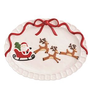 Decorative plate with Santa Claus and reindeer design on a white background