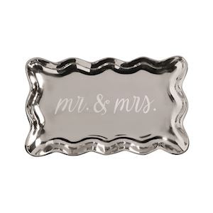 silver platter with writing on it