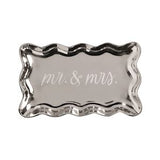 silver platter with writing on it