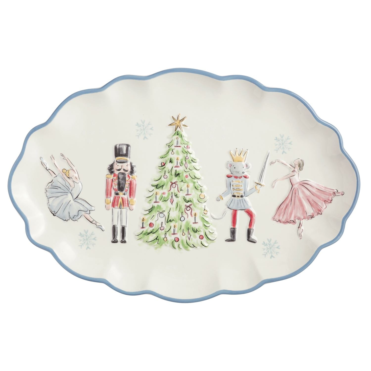 An oval ceramic serving platter with a scalloped edge, featuring a festive holiday illustration of a nutcracker, a princess, a prince, and a ballerina around a decorated Christmas tree on an off-white background with a blue rim.