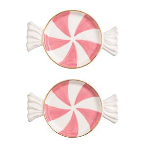 Two pink and white peppermint candy-shaped cookies on a white background