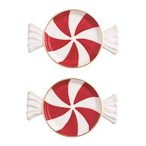 Two red and white peppermint candy-shaped plates on a white background