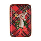 A rectangular decorative item with rounded corners featuring a festive holiday design. The background is a red and black plaid pattern, with a central illustration of a white deer wearing a red harness, surrounded by a green wreath with red berries and a large red bow.
