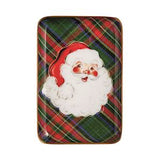 Decorative tin with Santa Claus design on a plaid background