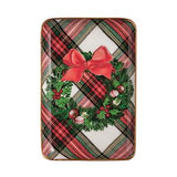 A rectangular holiday-themed product, likely a mat or cover, featuring a red and green plaid pattern with a central green wreath, red bow, and small red berries, shown on a plain white background.