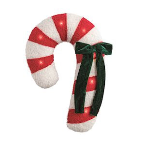Decorative candy cane with red and white stripes and a green bow on a white background