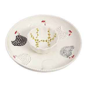 Decorative plate with hedgehog and leaf designs on a white background