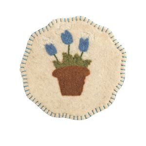 Decorative patch with a pot of blue flowers on a beige background