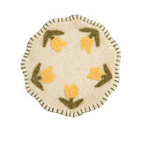 Round felt coaster with yellow tulip design on a white background