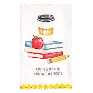 A white kitchen tea towel featuring a watercolor illustration of a coffee cup, books, an apple, and a pencil, with the text 'I DON'T RISE AND SHINE, I CAFFEINE AND EDUCATE.' and a yellow star-patterned border at the bottom.