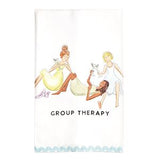 A white kitchen towel featuring an illustration of three women in vintage dresses holding wine glasses, with the text 'GROUP THERAPY' printed below. The towel has a light blue scalloped border at the bottom.