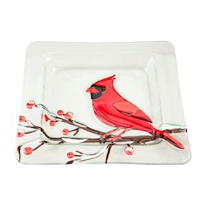 Square glass plate with a red cardinal bird design on a white background
