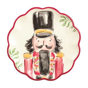 Decorative plate with a nutcracker design on a white background