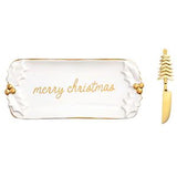 A white ceramic Christmas-themed serving tray with gold trim and the words 'merry christmas' in gold script, shown alongside a matching gold knife with a tree-shaped handle on a white background.