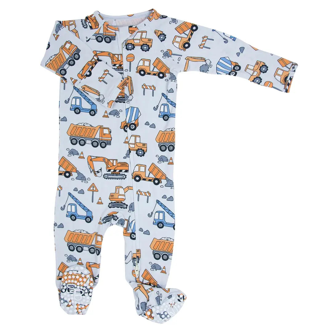 Baby onesie with construction vehicle pattern on a white background