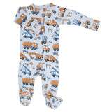 Baby onesie with construction vehicle pattern on a white background