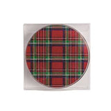 A round coaster with a red, green, and black tartan plaid pattern, presented inside a clear square plastic sleeve on a white background.