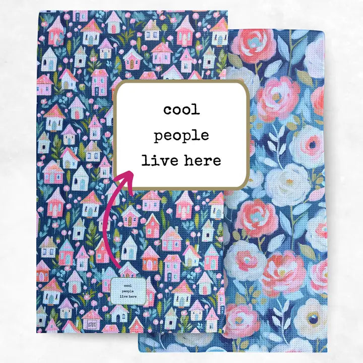 Two fabric panels with house and floral patterns and text 'cool people live here'.
