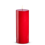 Red candle on a white background