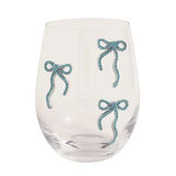 Clear glass with blue decorative bows on a white background