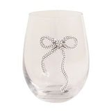 Clear glass wine glass with a decorative bow design on a white background